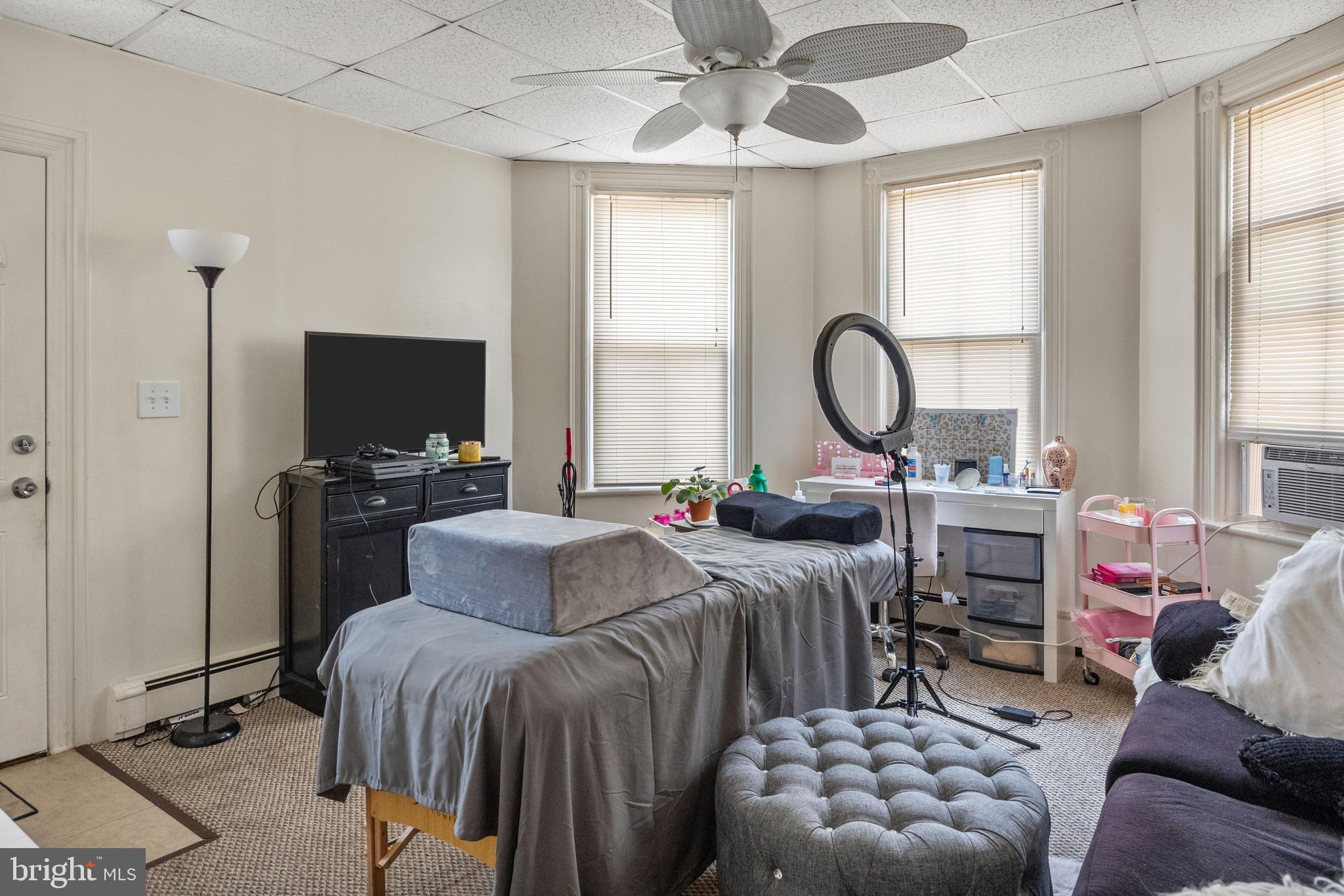 250 Washington Street Morrisville, PA 19067 - Photo 18 of 27 a living room with furniture a flat screen tv and a window