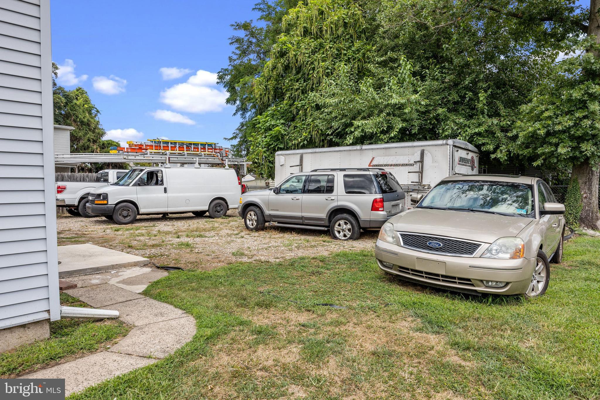 250 Washington Street Morrisville, PA 19067 - Photo 26 of 27 a cars parked in the grass near a yard
