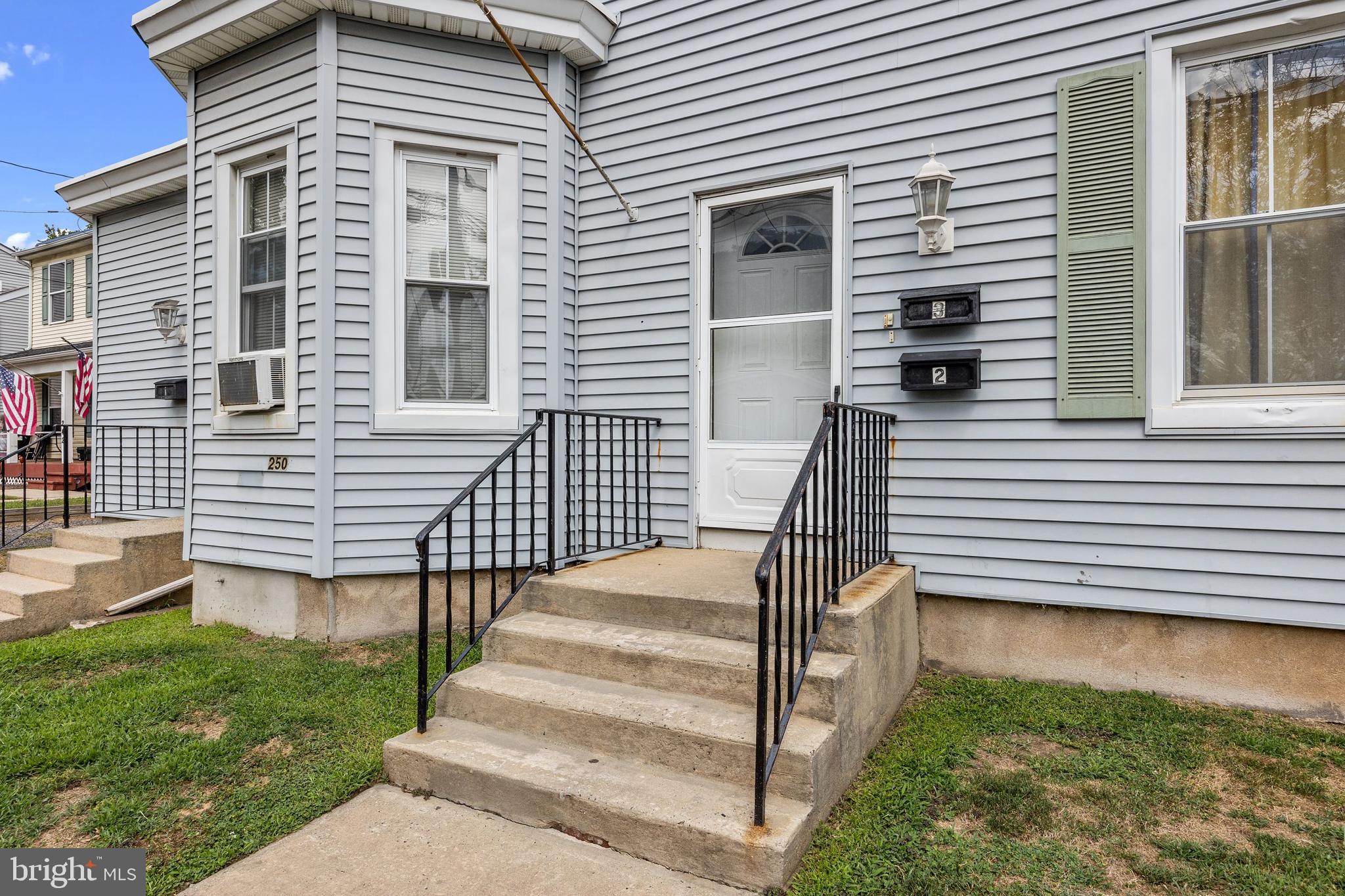 250 Washington Street Morrisville, PA 19067 - Photo 3 of 27 a view of a house with backyard and wooden fence