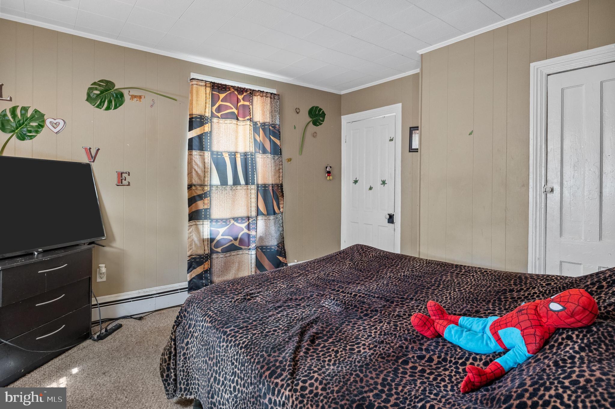 250 Washington Street Morrisville, PA 19067 - Photo 6 of 27 a bedroom with a bed and a television