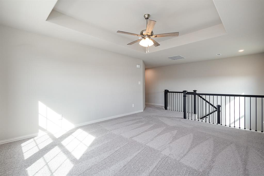 212 Painted Trail Forney, TX 75126 - Photo 14 of 26 a view of a livingroom with a ceiling fan and window