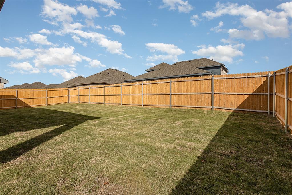 212 Painted Trail Forney, TX 75126 - Photo 22 of 26 a view of a backyard