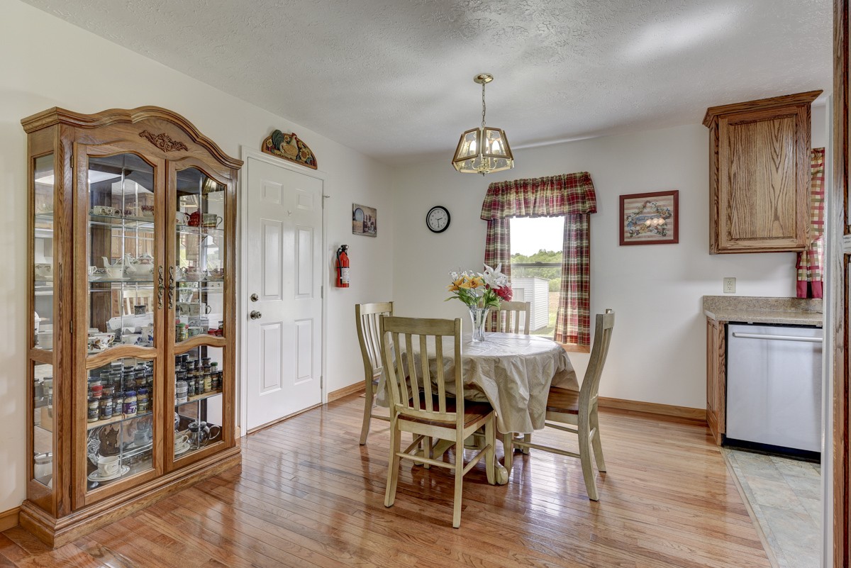 430 Fowler Ford Road Portland, TN 37148 - Photo 22 of 48 a view of a dining room with furniture window and wooden floor