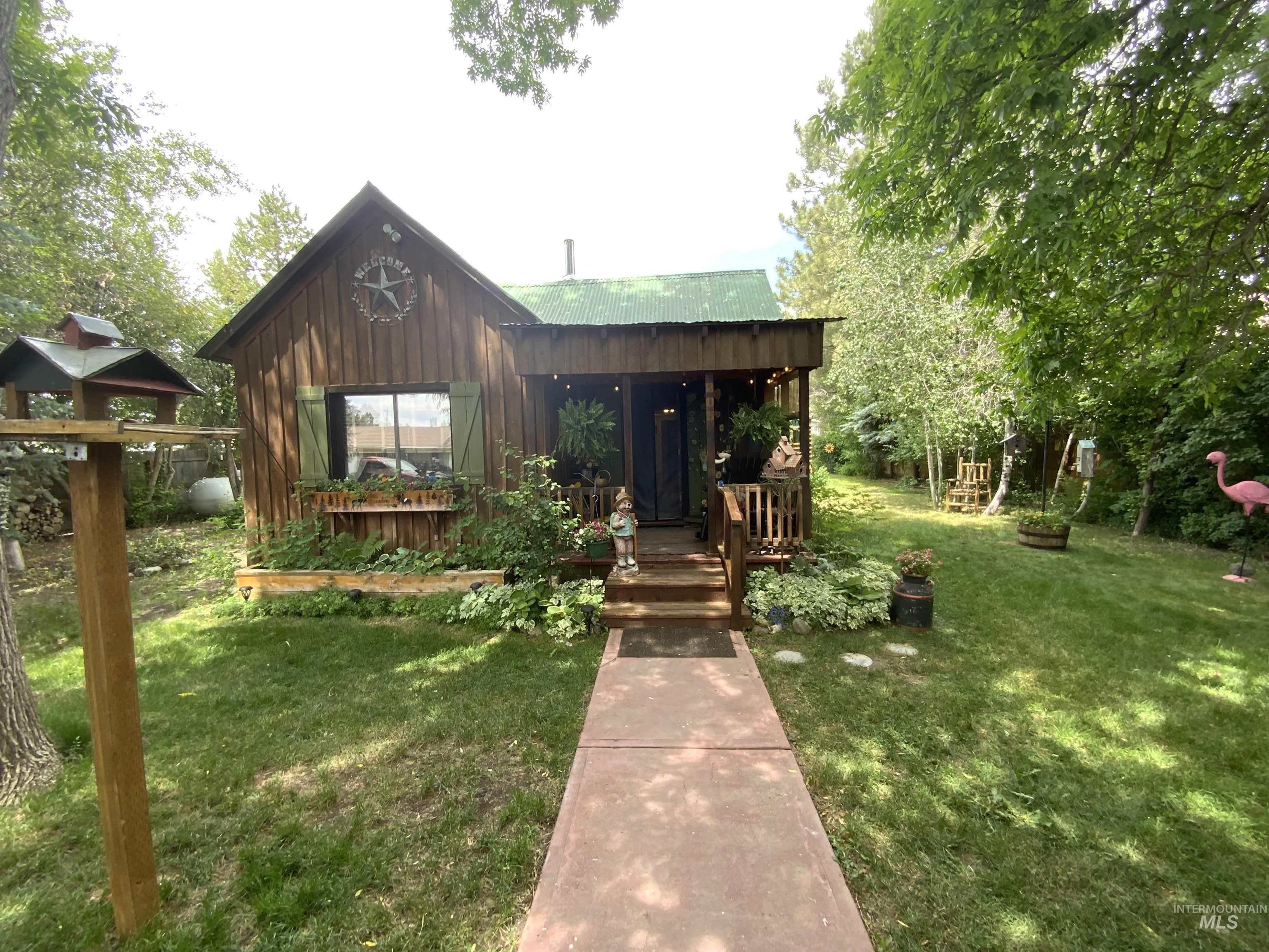 205 Alturas Avenue East Fairfield, ID 83327 - Photo 1 of 39 View of front of home featuring a front lawn and board and batten siding
