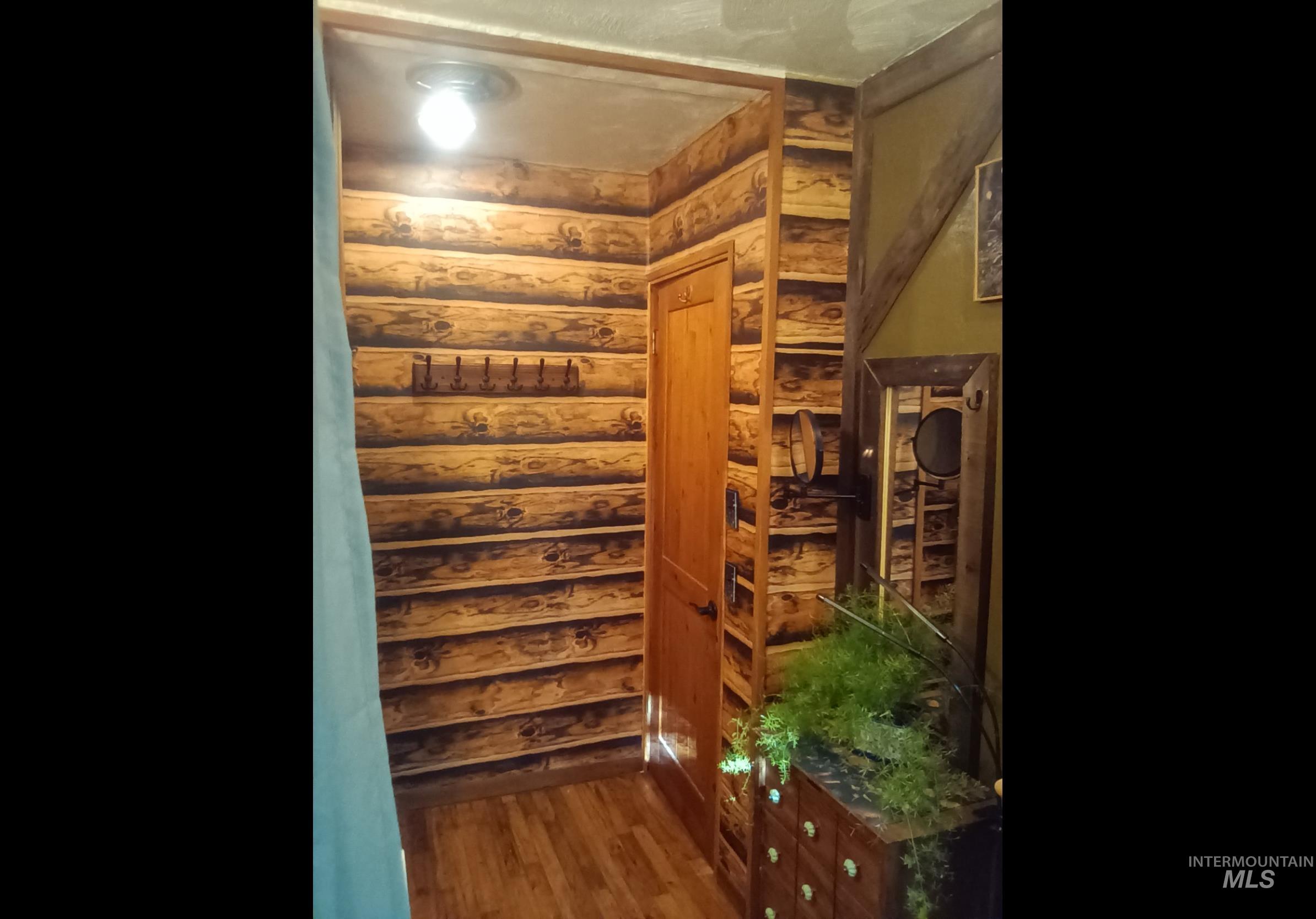 205 Alturas Avenue East Fairfield, ID 83327 - Photo 36 of 39 Wine area with wood finished floors and log walls