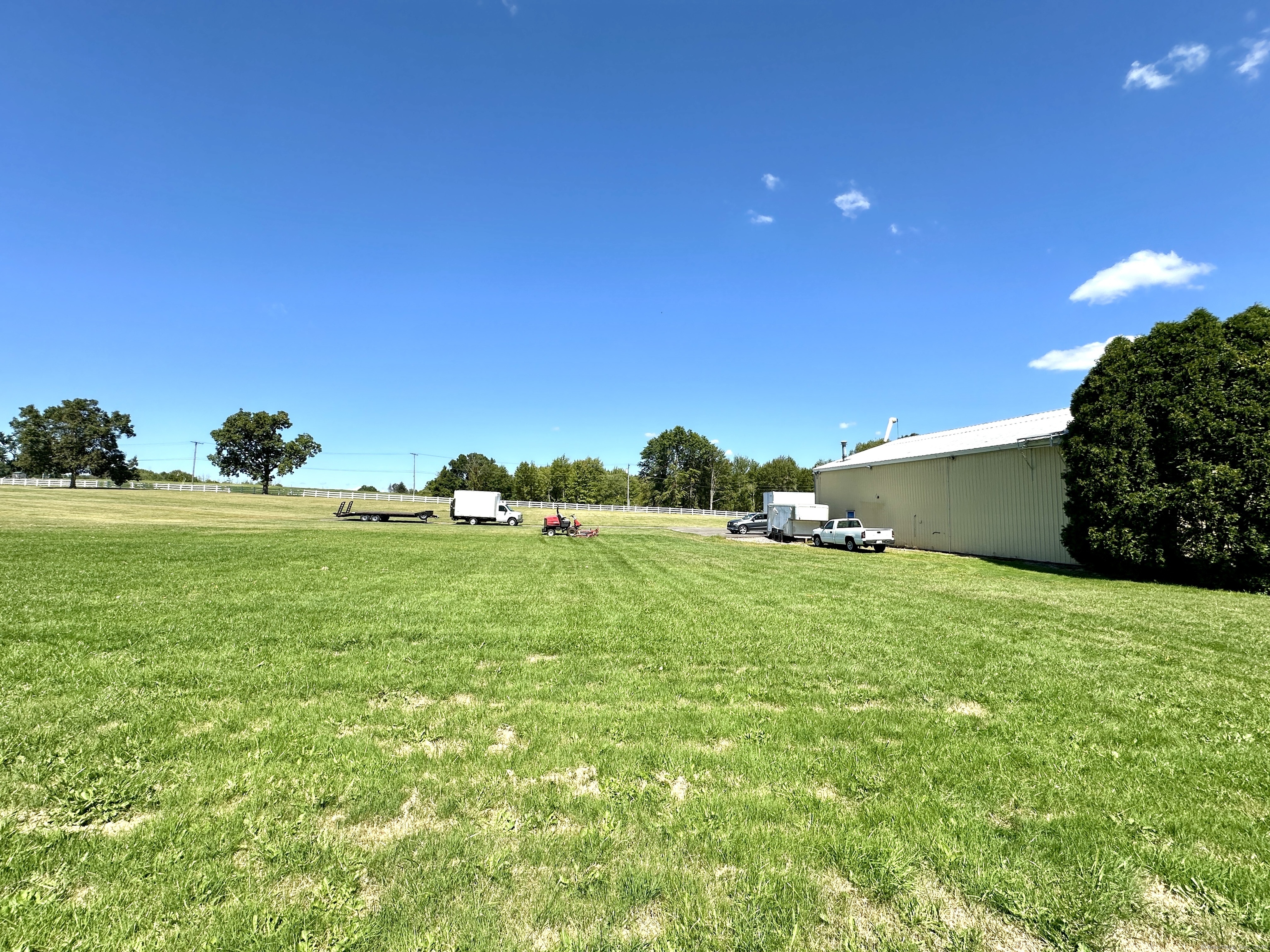 10 Russell Road East Granby, CT 06026 - Photo 13 of 30 a backyard of a house with lots of green space and outdoor seating