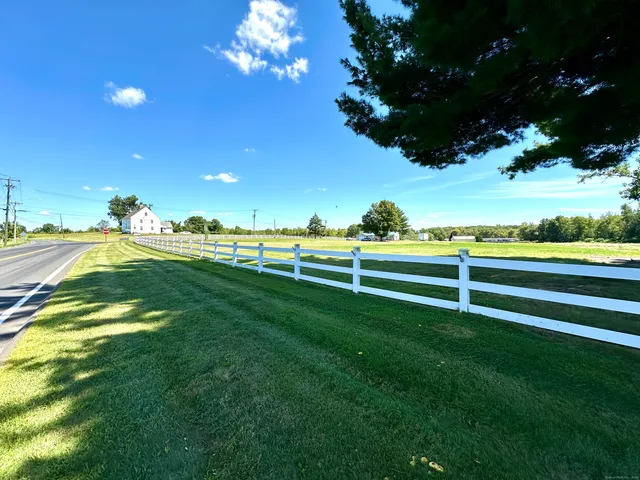 a view of a golf course with a swimming pool