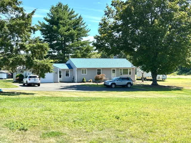 a view of a room with furniture and rug