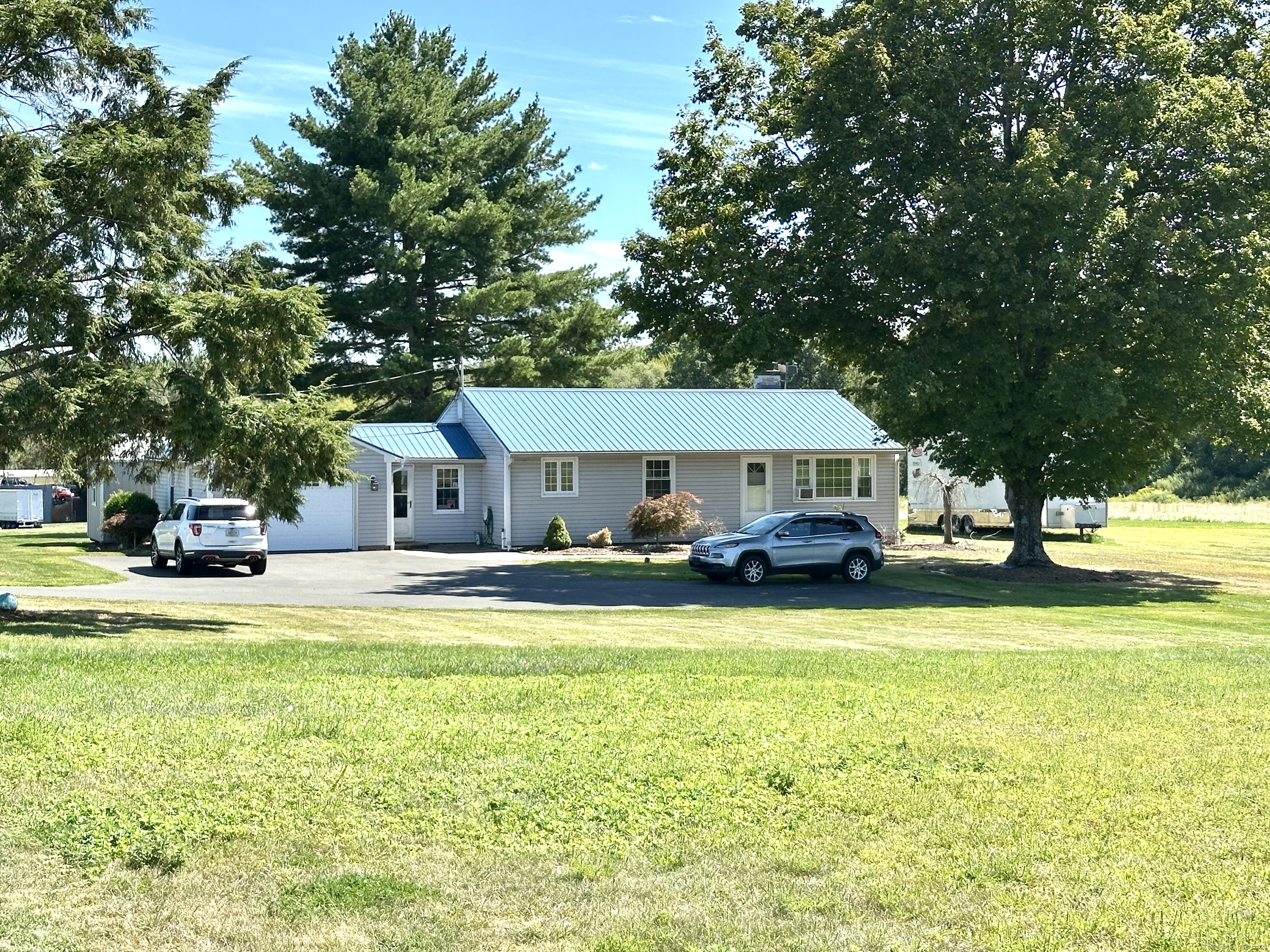10 Russell Road East Granby, CT 06026 - Photo 20 of 30 a view of a house with pool and a big yard