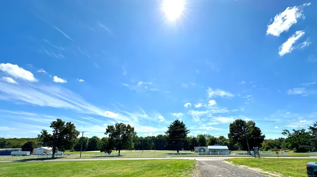 a dining room with a table and chairs