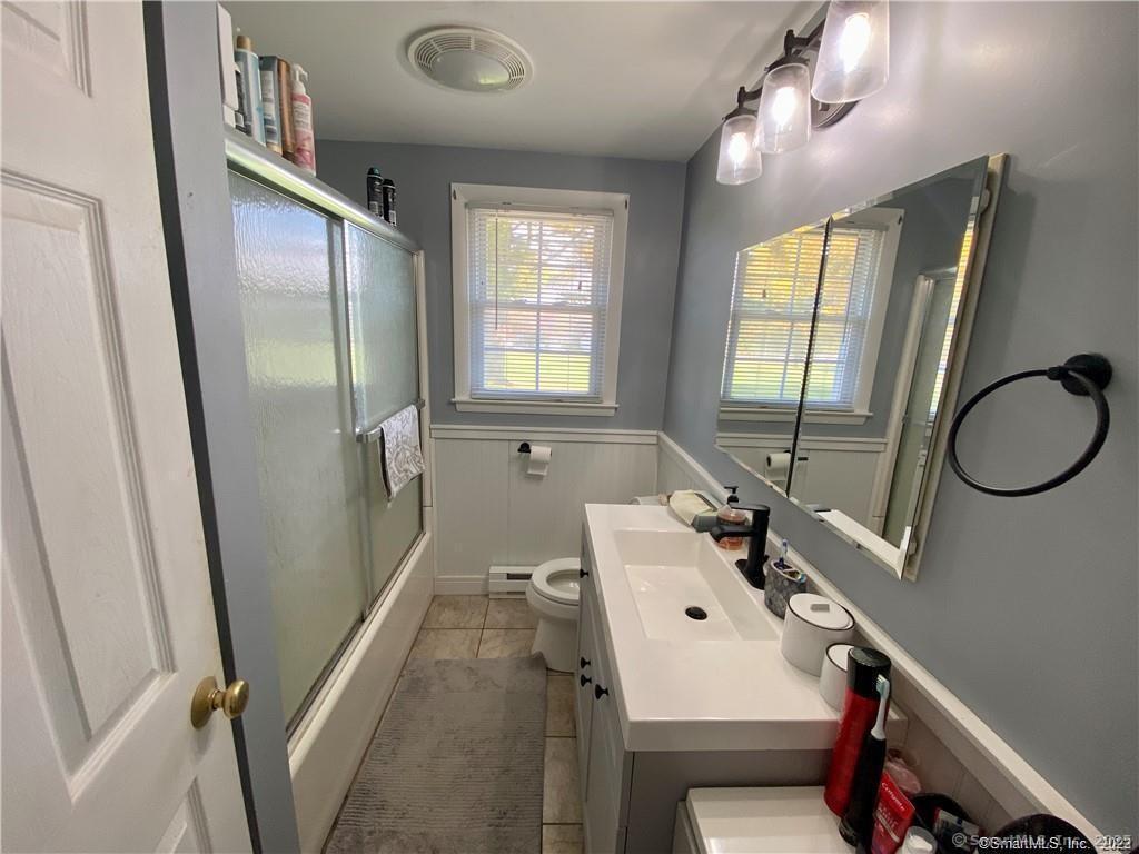 10 Russell Road East Granby, CT 06026 - Photo 29 of 30 a bathroom with a sink vanity mirror and toilet