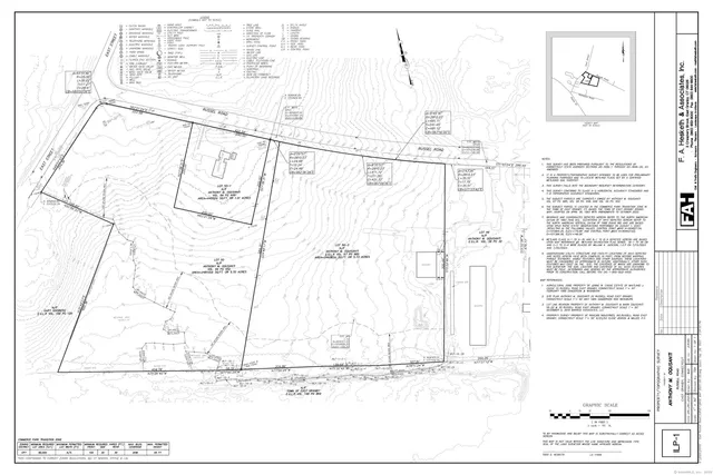 an aerial view of green landscape with trees houses and mountain view