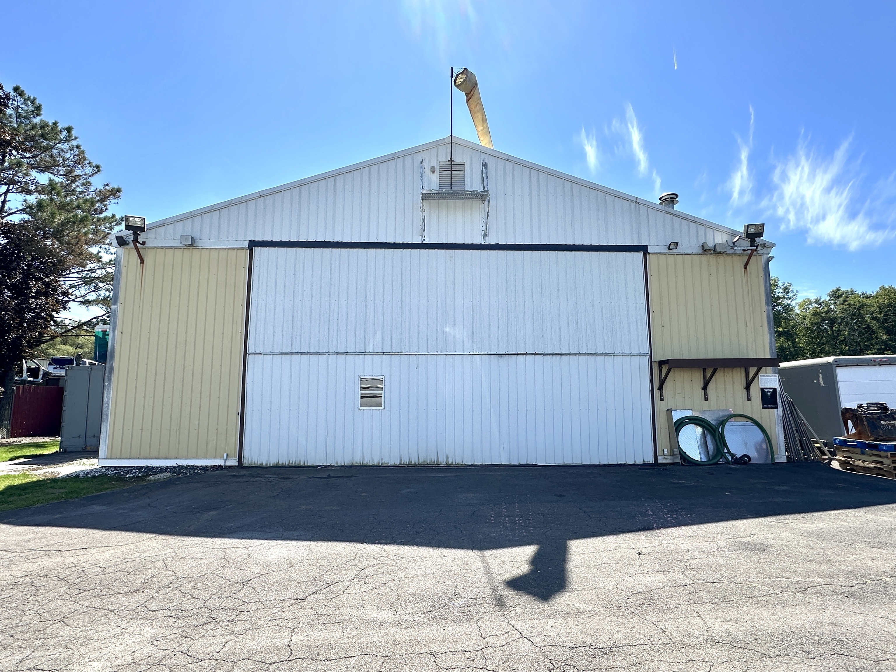 10 Russell Road East Granby, CT 06026 - Photo 7 of 30 a wooden bench sitting in front of a building