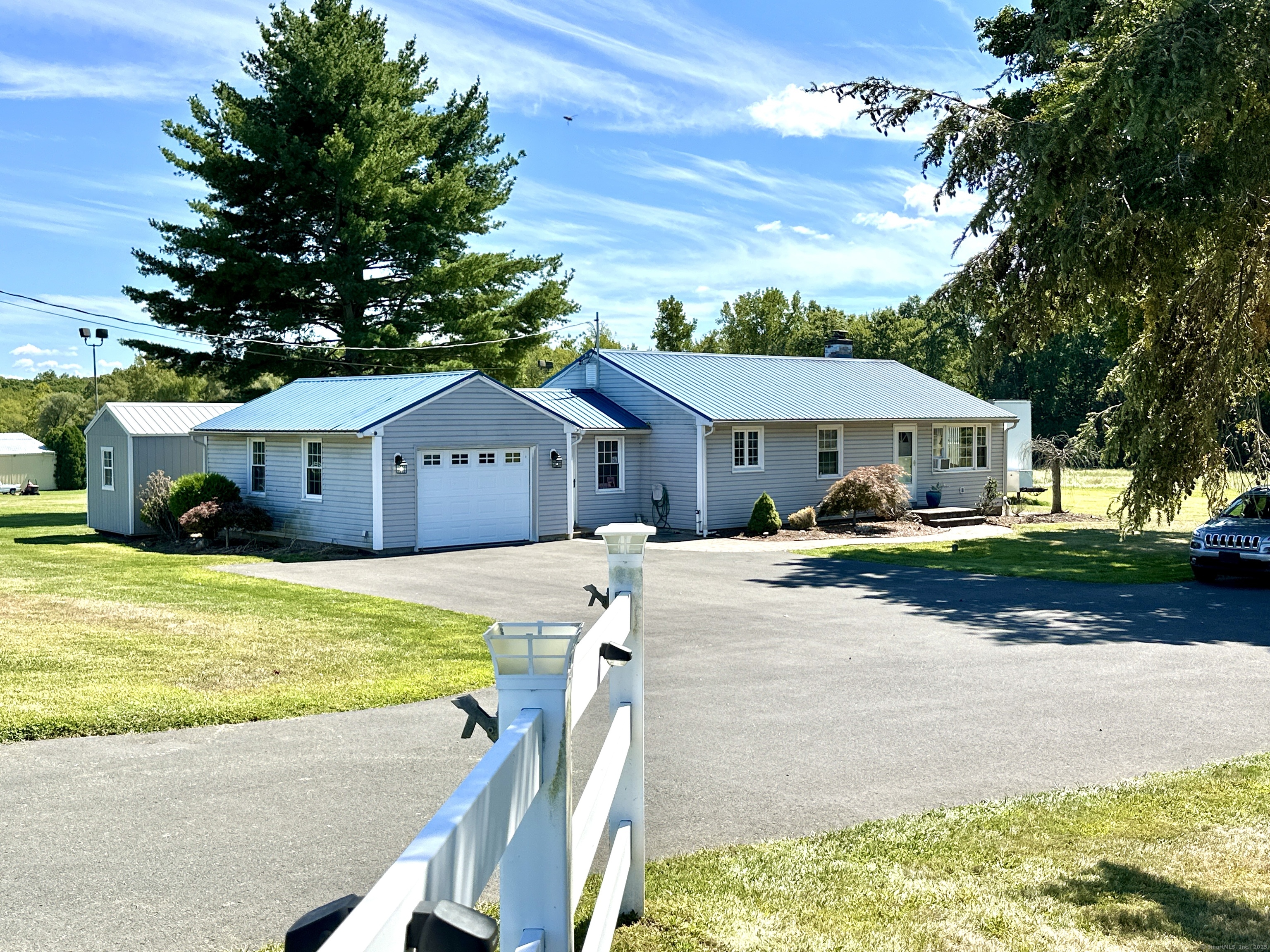 10 Russell Road East Granby, CT 06026 - Photo 10 of 30 a front view of house with yard outdoor seating and green space