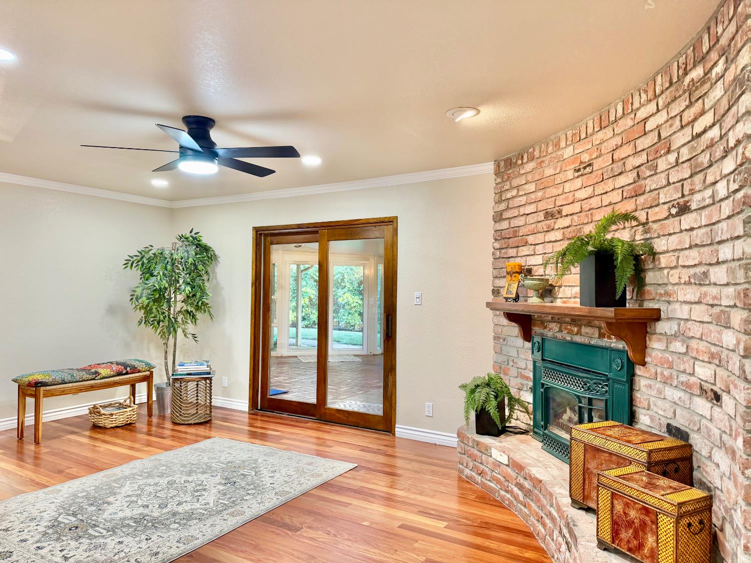 5706 Jeff Way Carmichael, CA 95608 - Photo 9 of 48 Great room with slider to the large sunroom with skylights and brick floor.