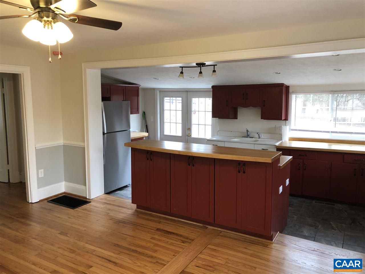 784 Poplar Spring Road Scottsville, VA 24590 - Photo 9 of 25 a bathroom with a granite countertop sink and a mirror