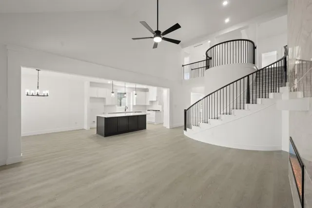 a view of hotel and hall with wooden floor
