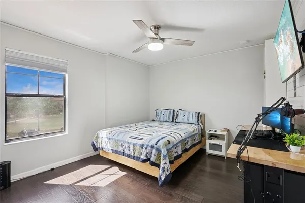 a bathroom with a tub a sink and a mirror