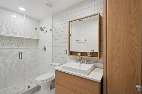 a stove top oven sitting inside of a kitchen