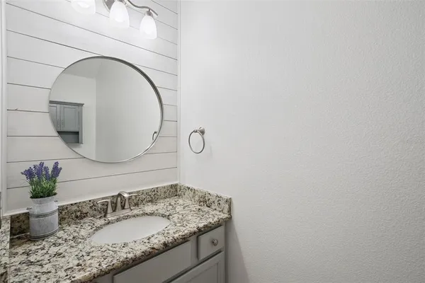 a living room with furniture a rug and a large window