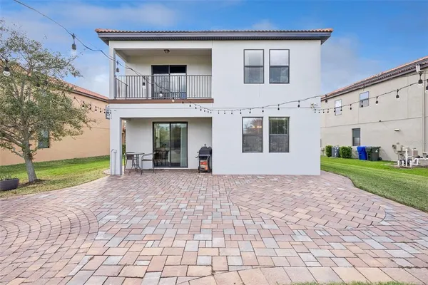 a view of swimming pool with outdoor seating and plants