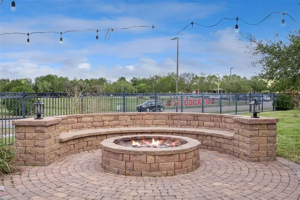 a front view of a house with a yard table and chairs