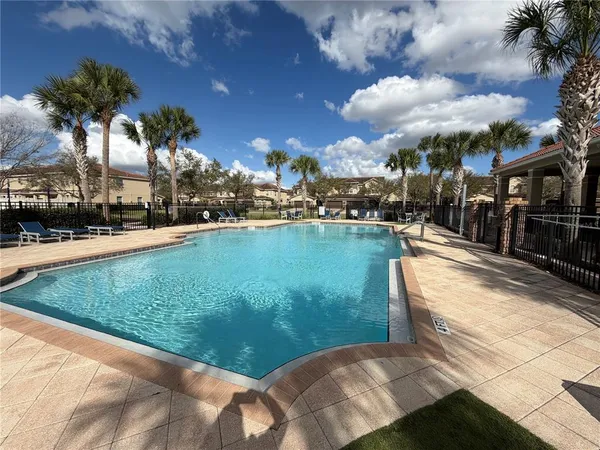 a view of a swimming pool with a patio