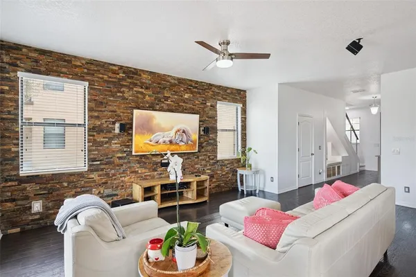 a living room with furniture and a large window