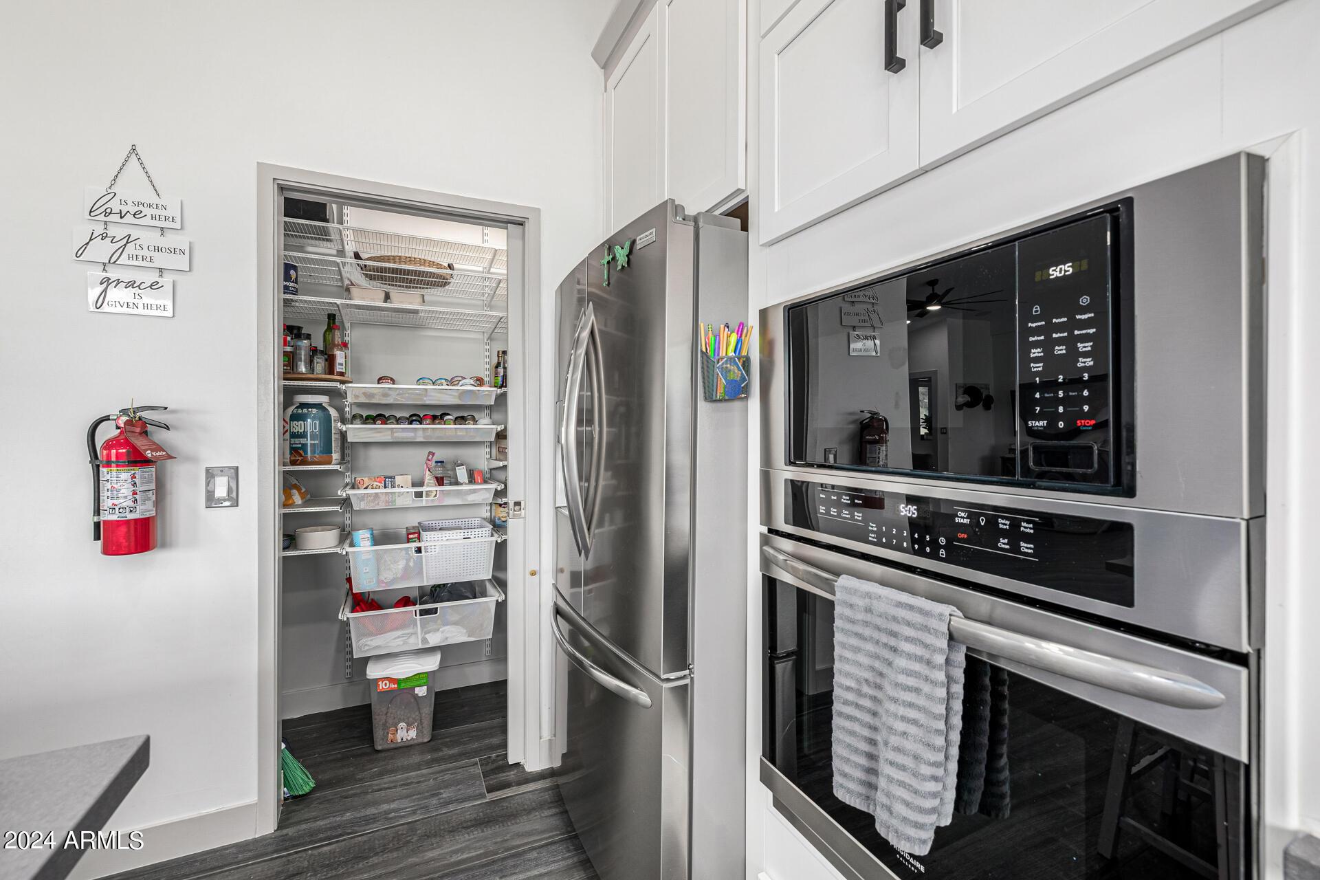 1829 West Cloud Road Phoenix, AZ 85086 - Photo 25 of 137 a kitchen with stainless steel appliances a refrigerator and a stove top oven