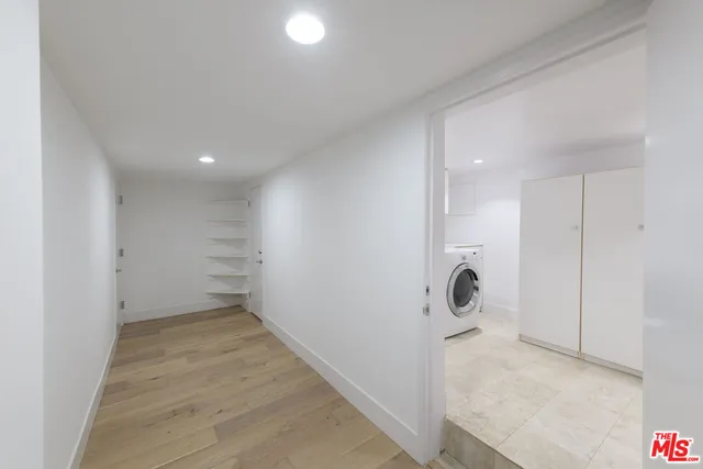 a utility room with sink dryer and washer