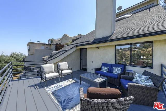 a view of outdoor space with wooden floor