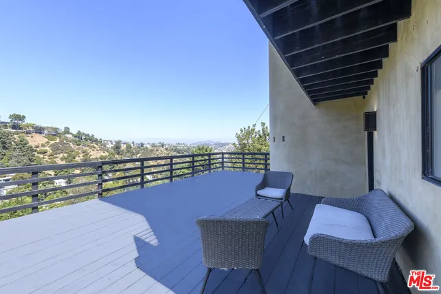 a view of a patio with wooden floor