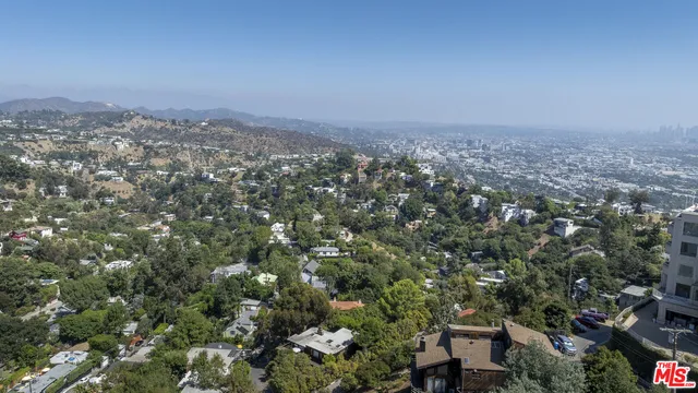 a view of a house with a mountain