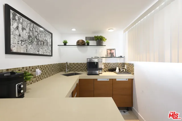 a kitchen with a sink and cabinets