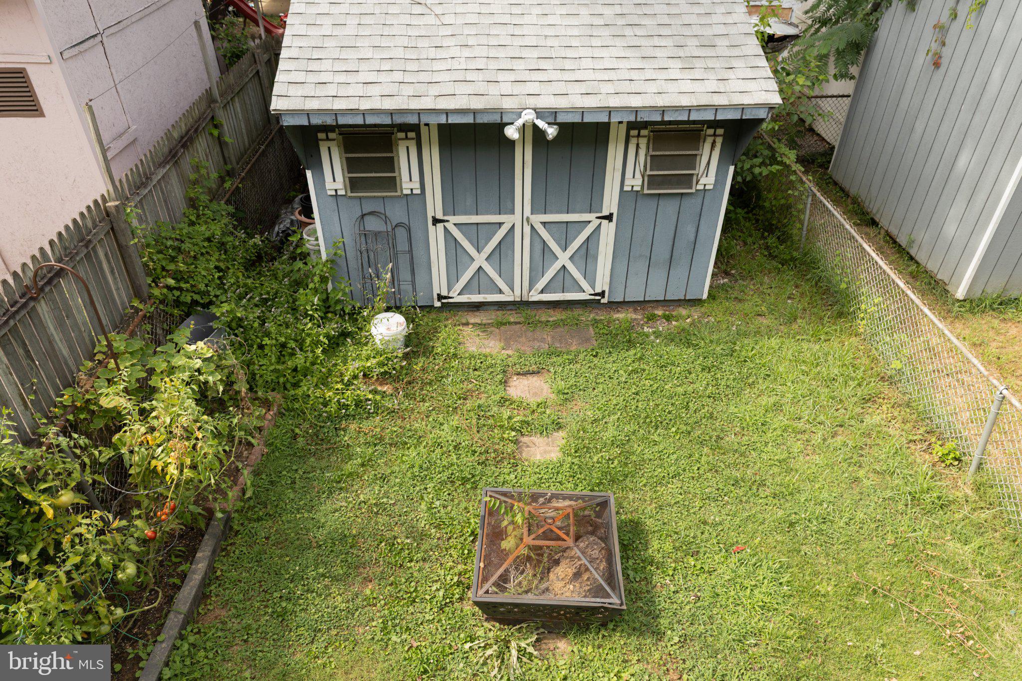 12626 Chilton Road Philadelphia, PA 19154 - Photo 42 of 43 Charming garden shed in lush greenery.