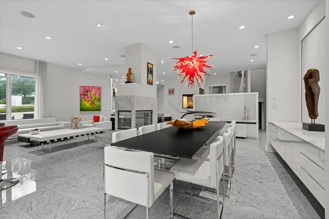 a large kitchen with kitchen island a large counter space a sink appliances and cabinets