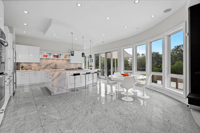 a living room with furniture and kitchen view