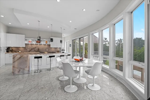 a view of a back yard of the house with a lake view