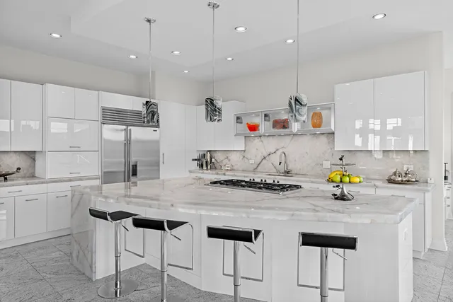 a view of a livingroom with furniture and a flat screen tv