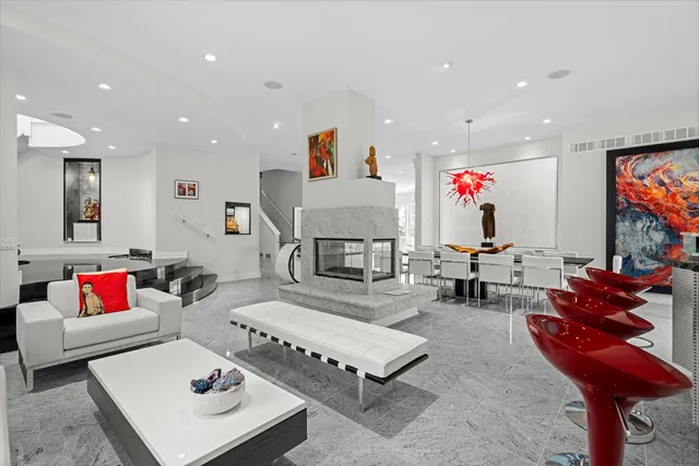 a large bedroom with bed tv and window