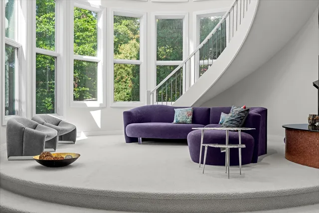an aerial view of a house with a yard table and chairs