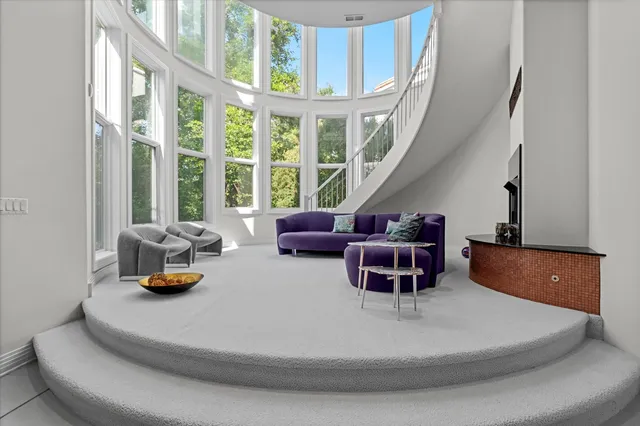 an aerial view of residential house with outdoor space and trees around