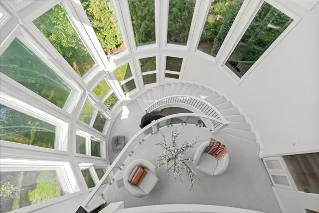 a living room with furniture and kitchen view