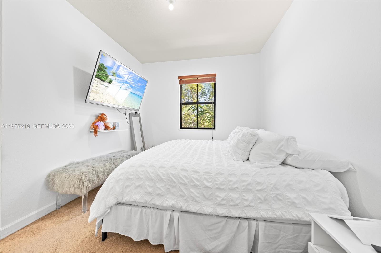 11734 Southwest 238 Street Homestead, FL 33032 - Photo 11 of 28 a bedroom with a bed and a window