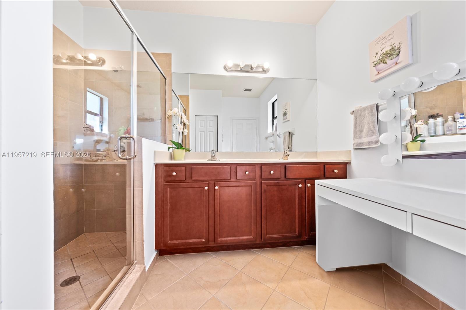 11734 Southwest 238 Street Homestead, FL 33032 - Photo 18 of 28 a spacious bathroom with a mirror and shower