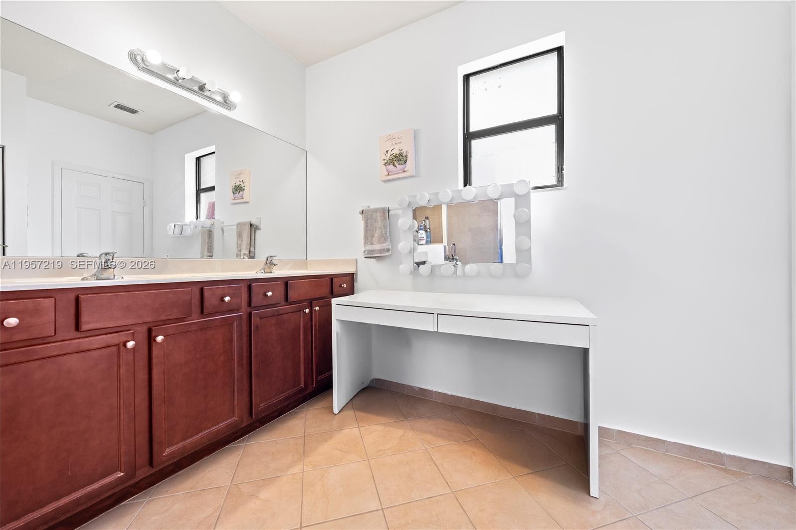 11734 Southwest 238 Street Homestead, FL 33032 - Photo 19 of 28 a bathroom with a sink vanity and mirror