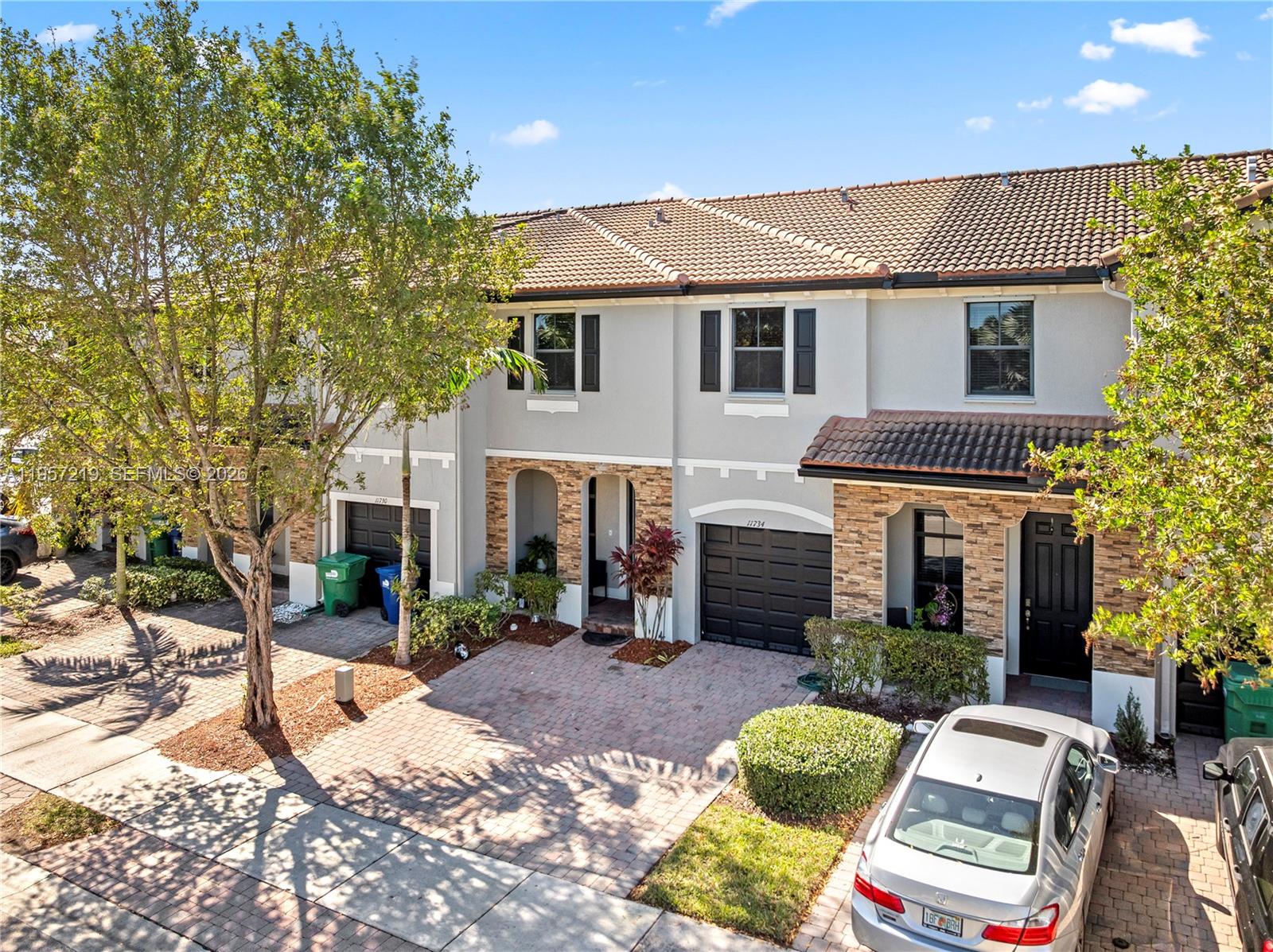 11734 Southwest 238 Street Homestead, FL 33032 - Photo 28 of 28 a view of a patio with chair and tables