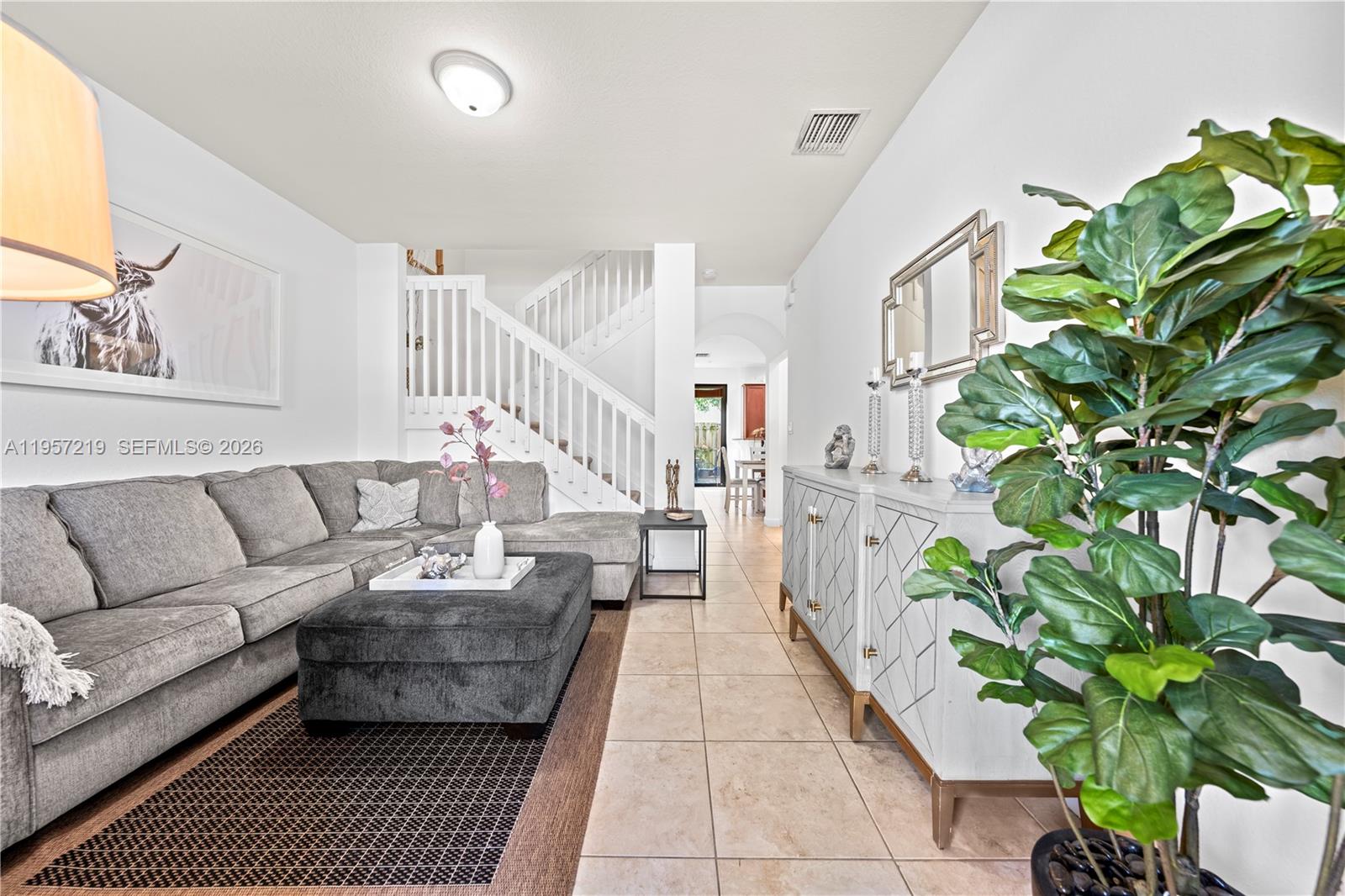 11734 Southwest 238 Street Homestead, FL 33032 - Photo 3 of 28 a living room with furniture plant and a potted plant