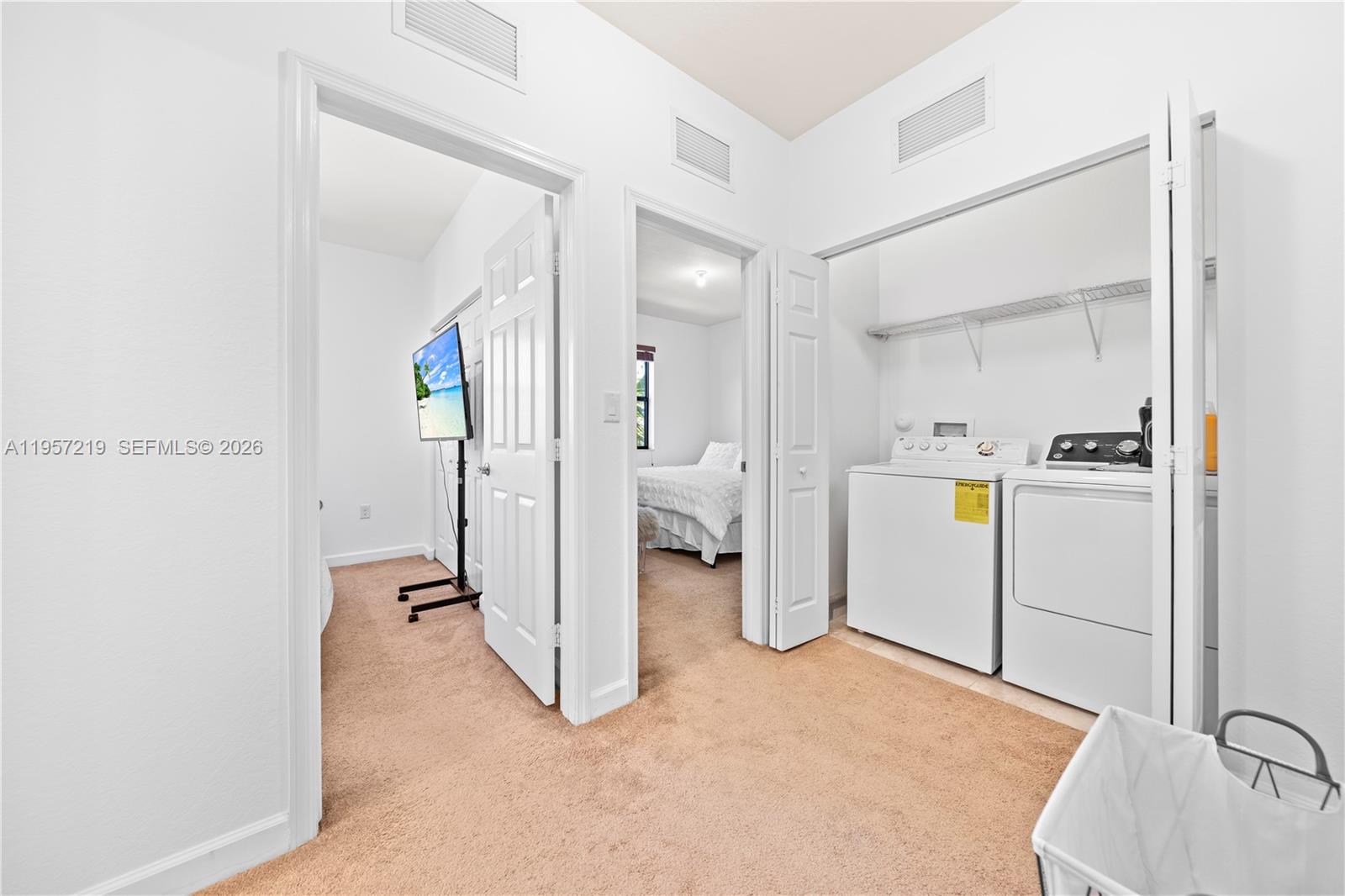 11734 Southwest 238 Street Homestead, FL 33032 - Photo 8 of 28 a view of a kitchen with refrigerator and white walls