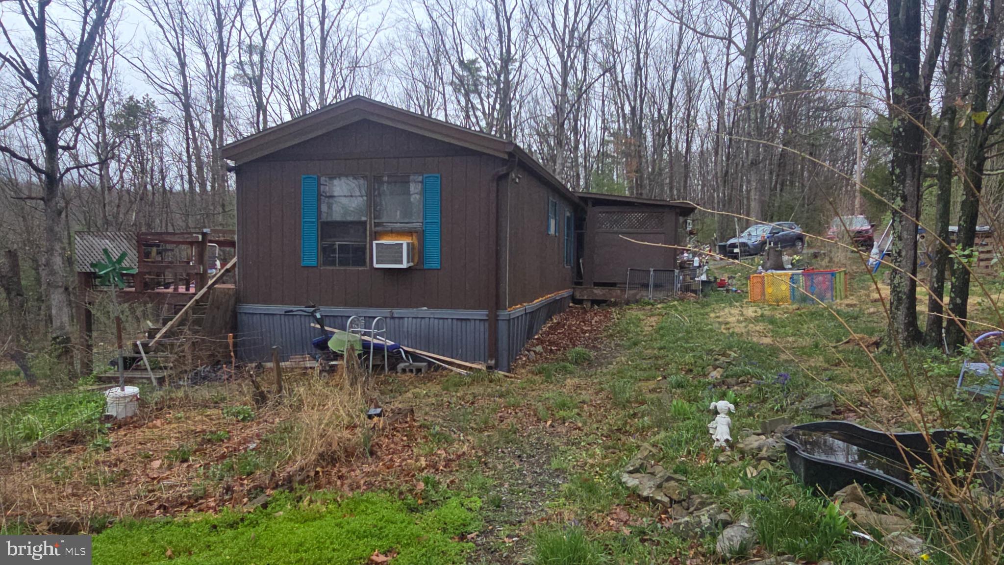 200 David's Road Delray, WV 26714 - Photo 3 of 19 a front view of a house with garden